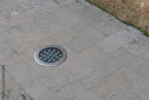 LED street lamp on the sidewalk. Lighting in parks and walking areas of the city. An electric lamp for the street.