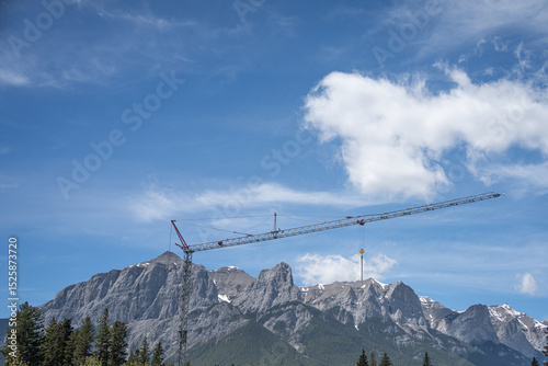 Industrial Crane on construction site in the mountains