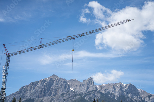 Industrial Crane on construction site in the mountains