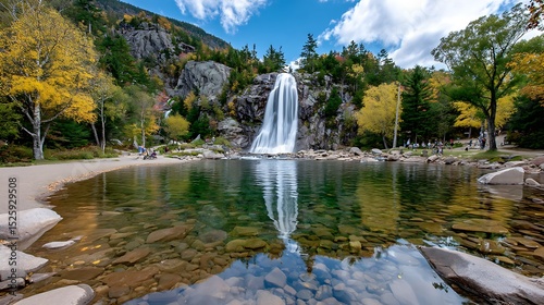 Serene Waterfall Surrounded by Autumn Trees and Reflective Lake in Mountain Landscape