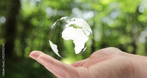 Animated white Earth planet spinning in a man's open palm.