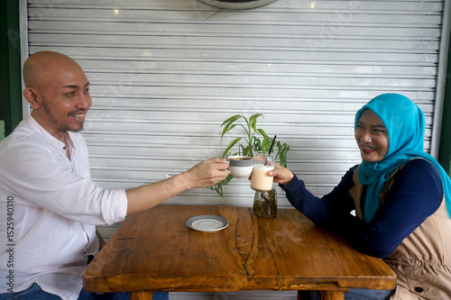 Love And relationship. Young Asian Couple Having Date And Toasting At Coffee Shop