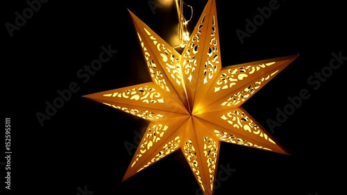 Star-Shaped Paper Decorations.Christmas symbol wallpaper. Glowing festive decor. 4k footage