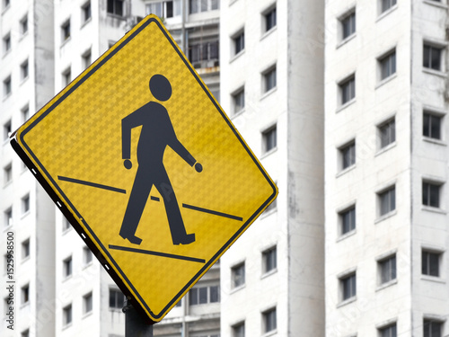 pedestrian crossing sign in front of apartment, urban safety traffic sign