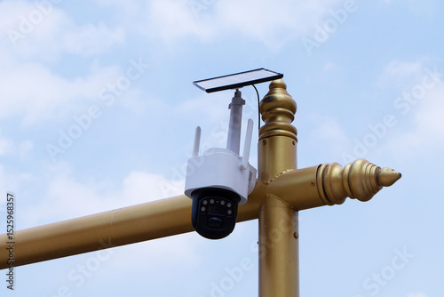 Fototapeta Naklejka Na Ścianę i Meble -  Closed-circuit camera, small CCTV for to small steel pole with Solar panels and beam by sky cloud white is background. Can record events such as traffic, accidents. Prevent thief. Modern technology.