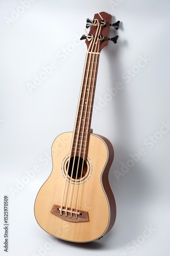 Four-string bass ukulele with wooden body and built-in tuner and pickup.