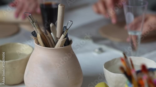 Many paint brushes in a jar. Creative hobby. 