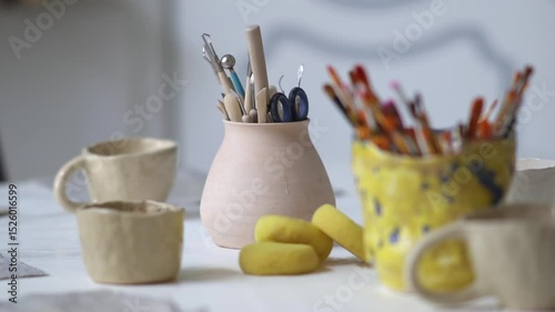 Many paint brushes in a jar. Creative hobby. 
