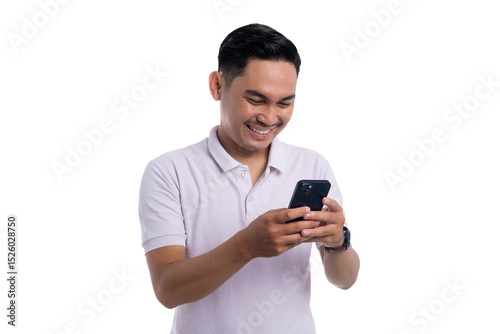 Happy young man smiling while using smartphone and typing message isolated on transparent background