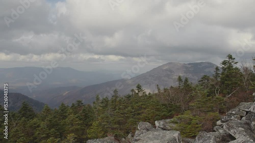 Heavy clouds in the autumn mountains. Timelapse