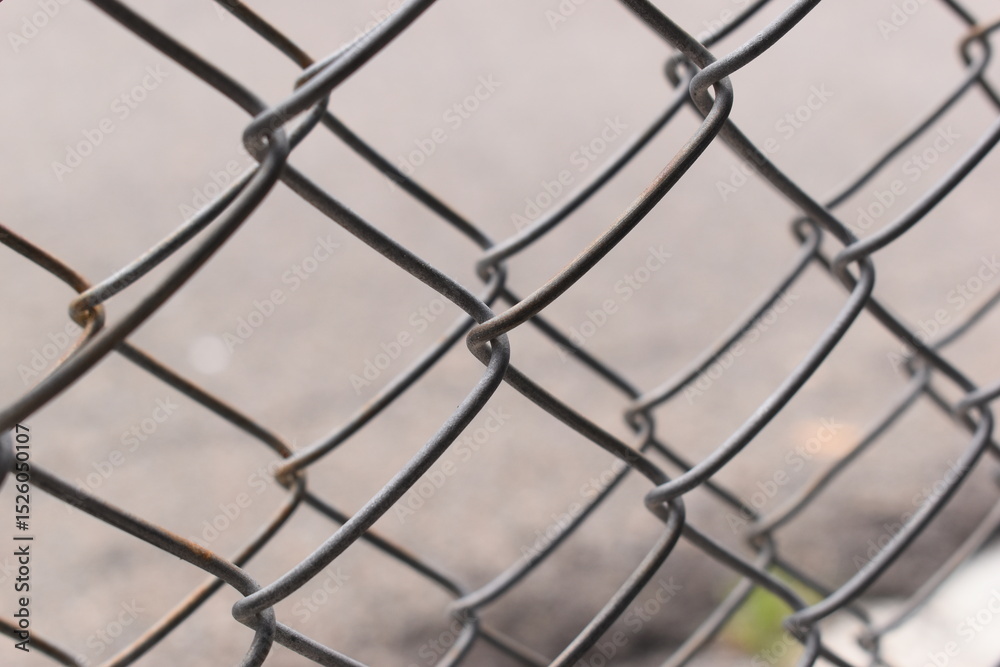 Fototapeta premium old wire mesh on dirty wall, construction industry