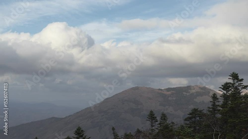 The sky above the autumn mountain. Timelapse