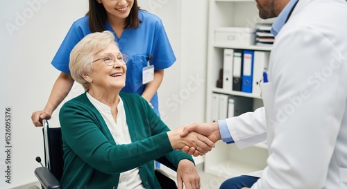 Doctor giving an handshake to a senior patient