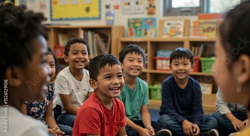 Happy diverse children sitting in a classroom learning environment
