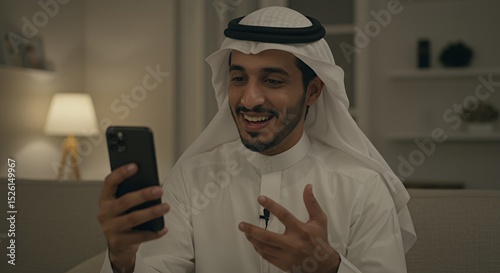 Smiling Arab Man Video Calling on Smartphone at Night
