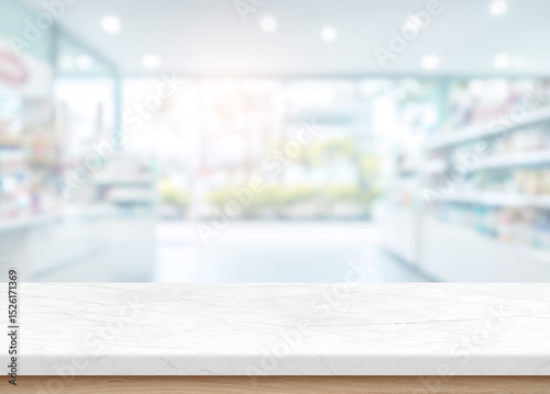 Empty marble counter in front of a softly blurred supermarket or retail store interior, perfect for product display and marketing visuals.