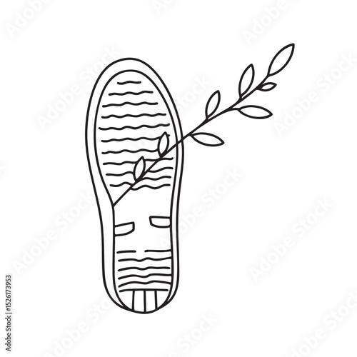 A twig sticking from the bottom of a shoe sole