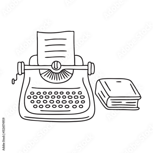 A closed book placed beside a typewriter