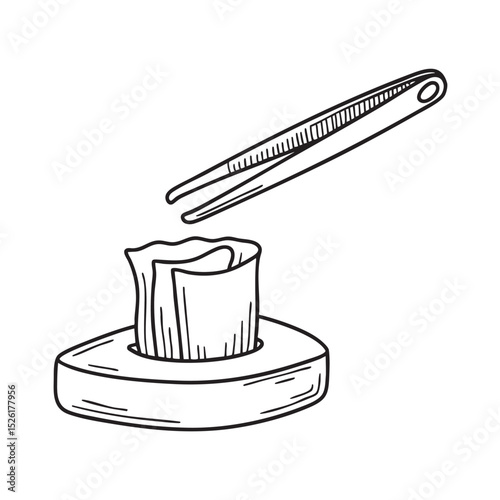 Tweezers placed near a folded tissue