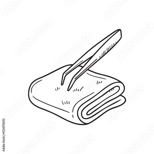 Tweezers resting on a small towel