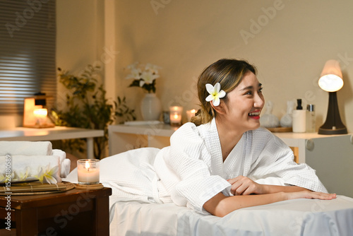 Beautiful young woman relaxing in spa salon
