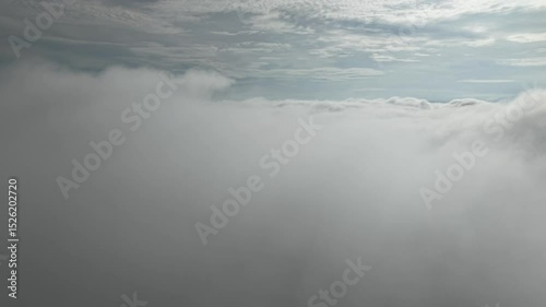 Majestic view above the clouds, capturing the endless expanse of the sky and its soft textures.