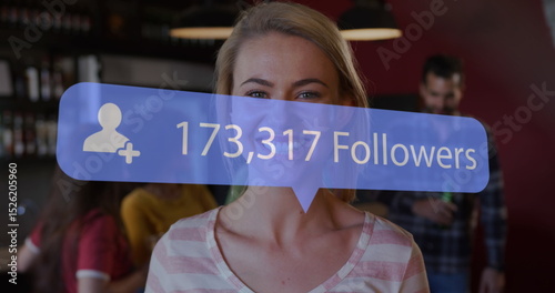 Image of speech bubble with increasing followers over portrait of caucasian woman smiling at bar