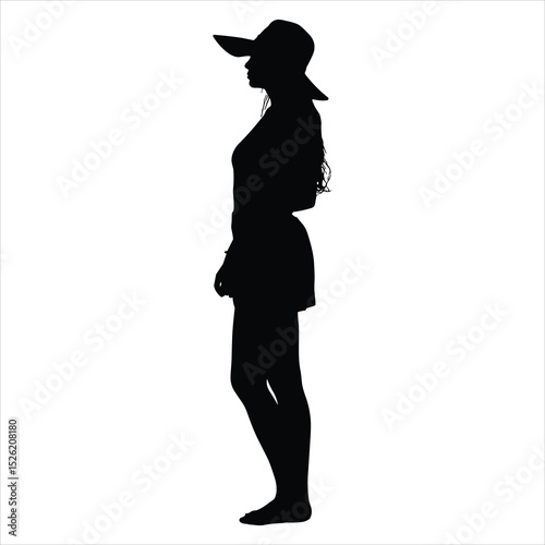 a graceful young girl standing and facing the horizon, wearing a wide floppy sunhat with a large brim and long flowing hair 
