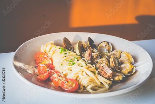 Miso Butter Vongole made with Clams, miso butter, tomatoes, linguine