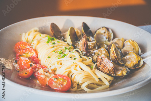 Miso Butter Vongole made with Clams, miso butter, tomatoes, linguine