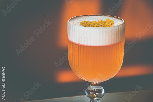 A Coconut Campari cocktail made with
Campari, gin, coconut, lemon