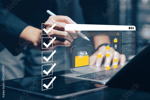 Digital document management and workflow automation: A hand uses a stylus on a tablet, with a laptop in the background, interacting with a holographic checklist and various digital document.