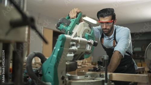 Carpenter is working together at workshop. Small business and craft product.