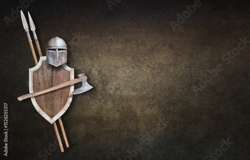 knight's helmet axe wooden shield and two spears on grunge background