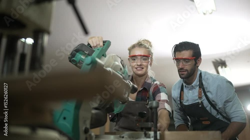 Carpenters are working together at workshop. Small business and craft product.