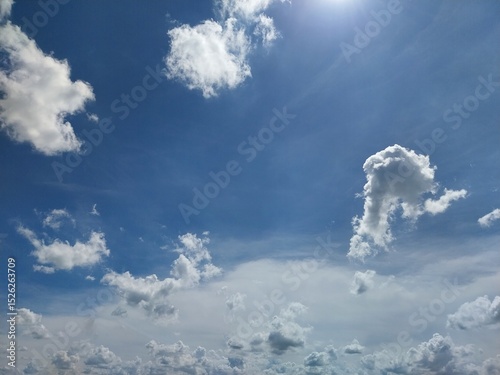 Sunlit sky revealing ethereal cloud patterns