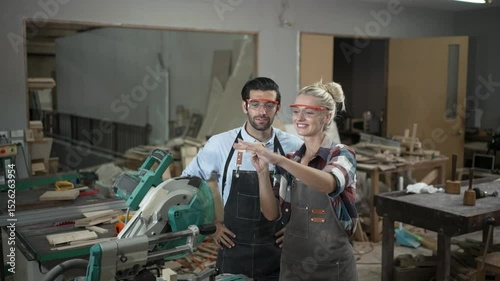 Carpenters are working together at workshop. Small business and craft product.