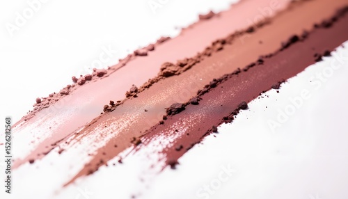 A macro shot showcases a row of intensely pigmented, creamy eyeshadow swatches. The swatches, ranging in tones from deep jewel to soft shimmer, lie distinctly separated on a pristine white background
