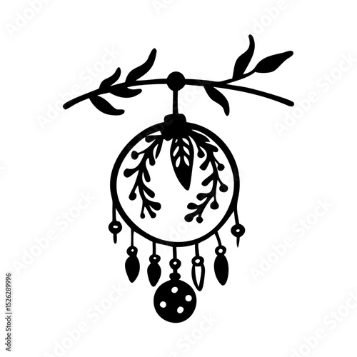 Decorative dreamcatcher with leaves and beads hanging from a branch in a minimalist style