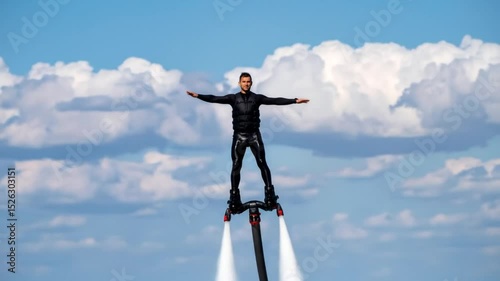 Flyboarding adventure: A man soars above the ocean waves with jet powered board