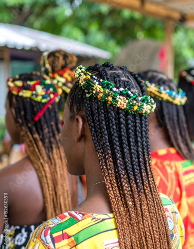 Traditional Ghanaian hairstyles, recreated on a mannequin head, showcasing intricate braiding and cultural aesthetics.