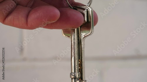 Hand holding keys to new home