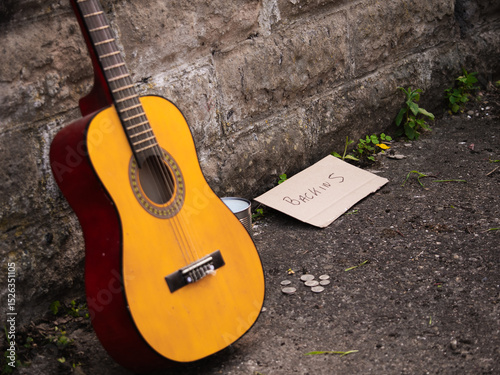 Street busker guitar goes for lunch break