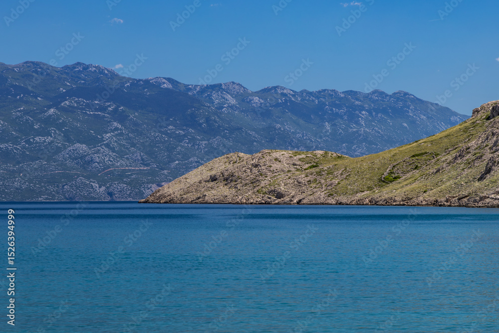 Obraz premium Panorama of the bay with the Vela Luka beach below, view of the beach from the top of the mountain, rocky beach