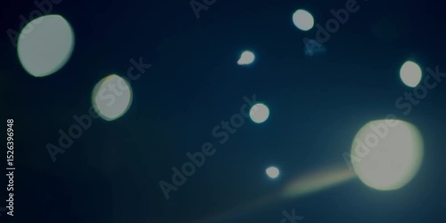 abstract light background A seamless loop of abstract light particles moving gracefully through a dark, ethereal space. Soft, dreamy bokeh effect.
Ideal for background or overlay. 4K, slow motion, cal