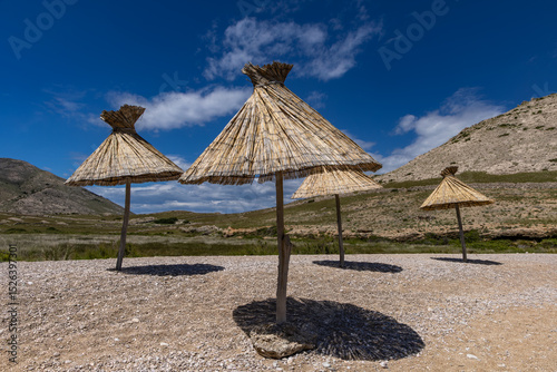 Fototapeta Naklejka Na Ścianę i Meble -  Panorama of the bay with the Vela Luka beach below, view of the beach from the top of the mountain, rocky beach