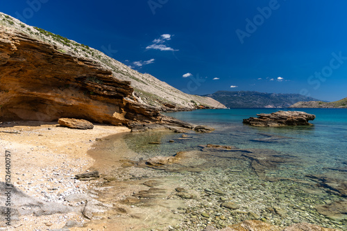 Fototapeta Naklejka Na Ścianę i Meble -  Panorama of the bay with the Vela Luka beach below, view of the beach from the top of the mountain, rocky beach