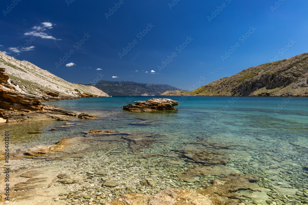 Fototapeta premium Panorama of the bay with the Vela Luka beach below, view of the beach from the top of the mountain, rocky beach