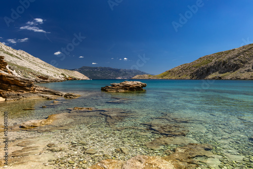 Fototapeta Naklejka Na Ścianę i Meble -  Panorama of the bay with the Vela Luka beach below, view of the beach from the top of the mountain, rocky beach
