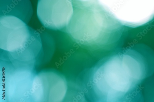 Abstract defocused light effect in teal and emerald green gradients photo